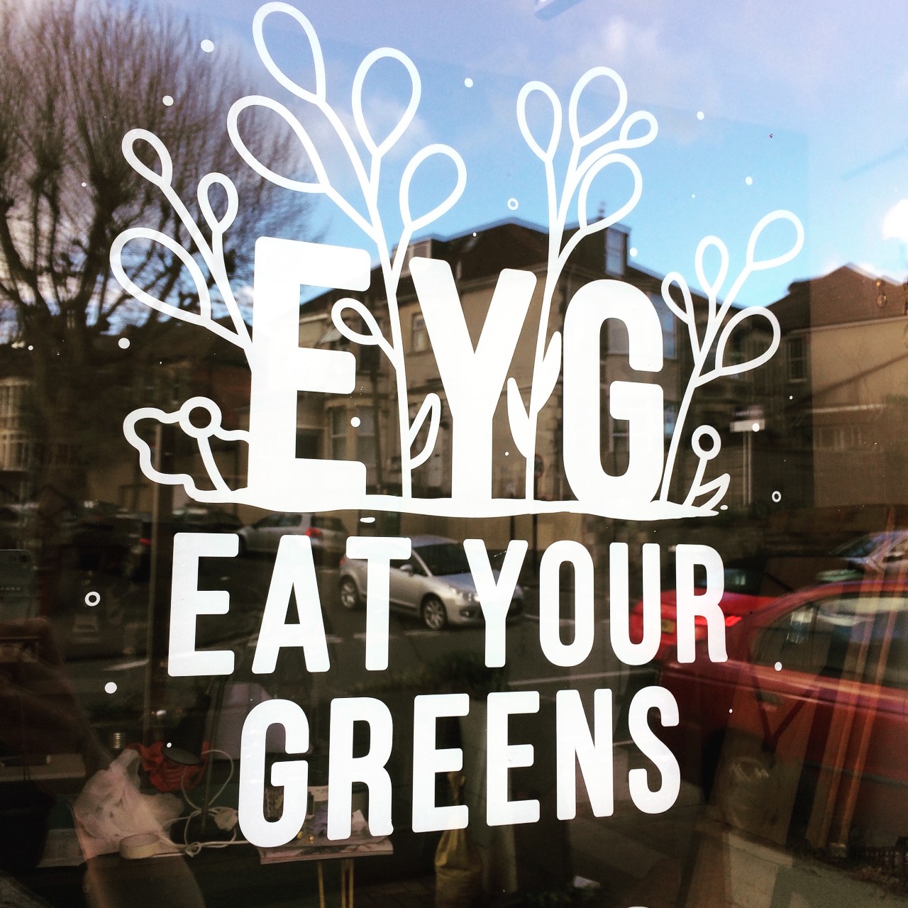 Eat Your Greens front of restauran
