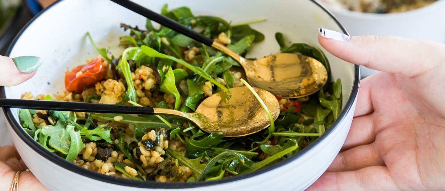 Sharing a plate of greens (Photo by S O C I A L . C U T on Unsplash)