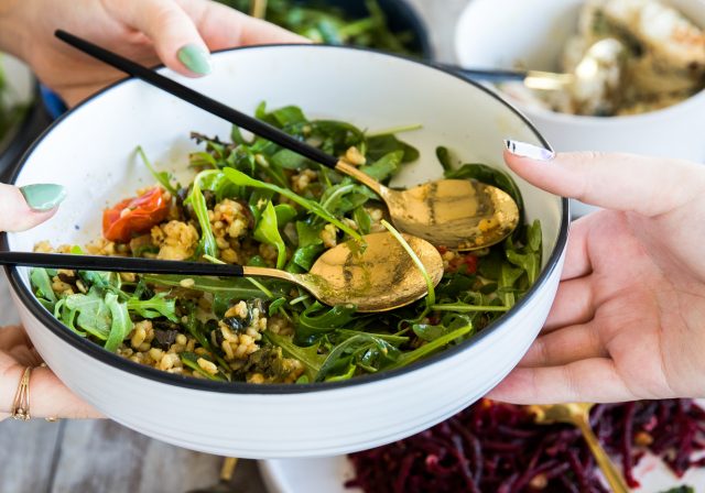 Sharing a plate of greens (Photo by S O C I A L . C U T on Unsplash)