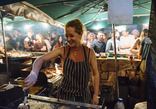 Serving food at the St Nick Night Market