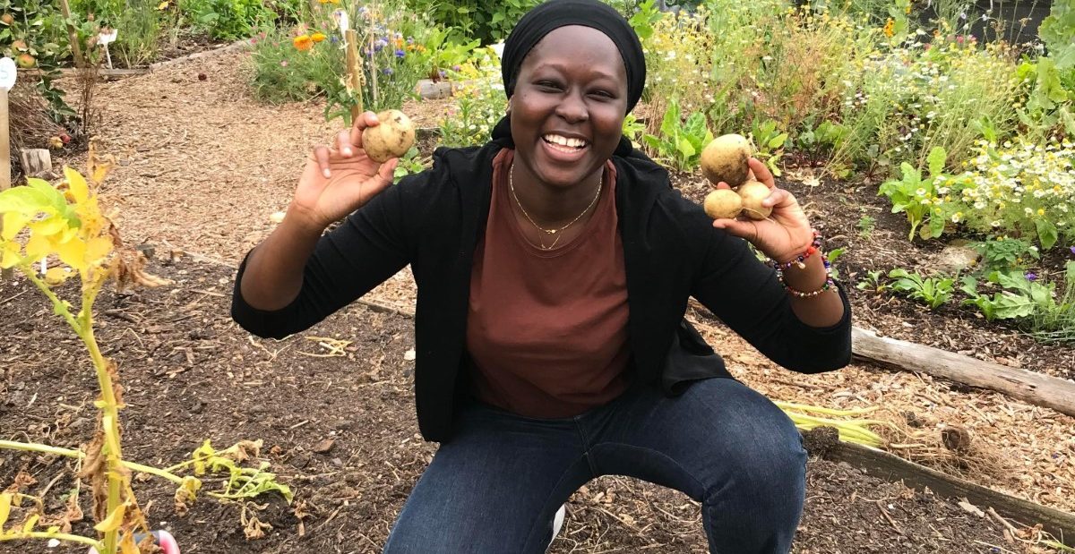 Propagation Place trainee holding up potatoes